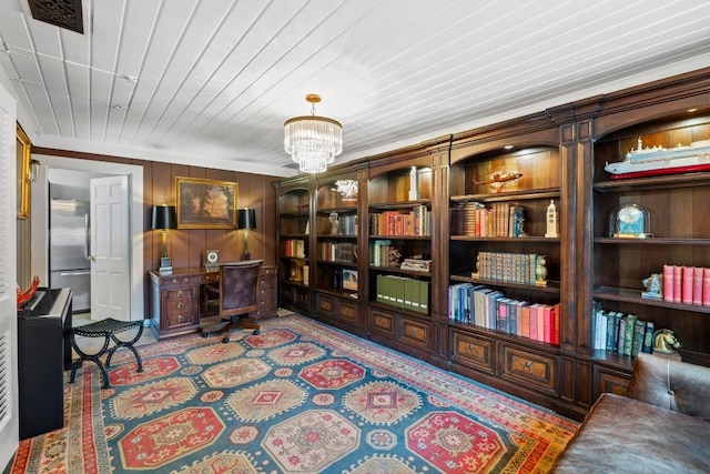 2621 W 45th St, Austin, TX 78731 - office area with a chandelier, wooden walls, and crown molding