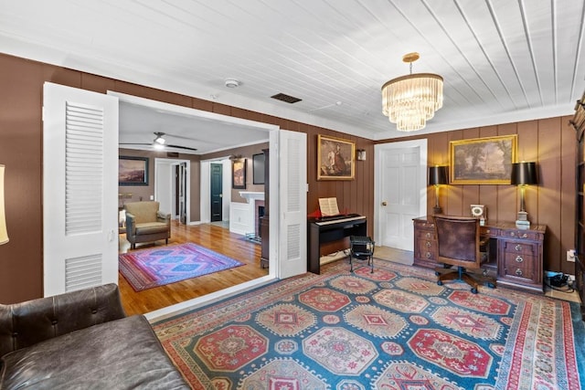 2621 W 45th St, Austin, TX 78731 - office featuring a chandelier, ceiling fan, and wood walls
