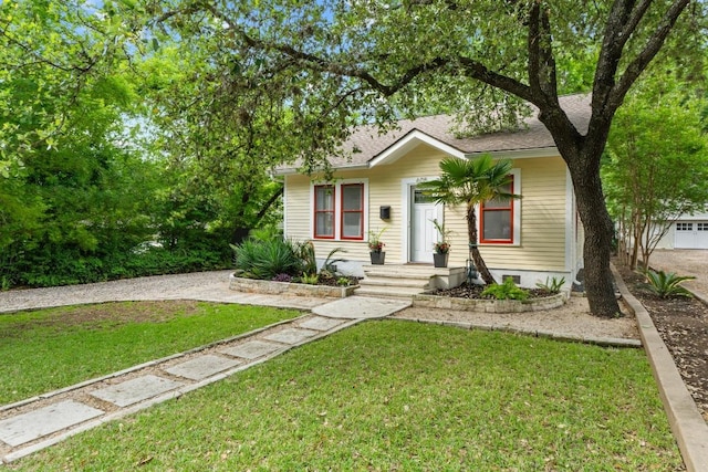 605 E 43rd St, Austin, TX 78751 - view of front of home featuring a front lawn and roof with shingles