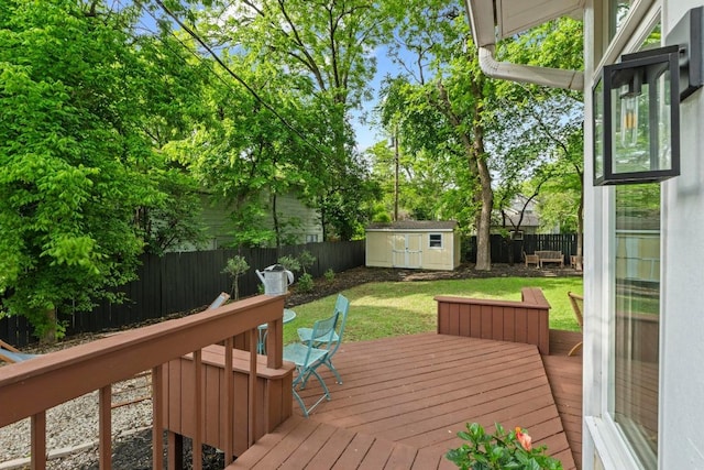 605 E 43rd St, Austin, TX 78751 - wooden terrace featuring a fenced backyard and a storage shed