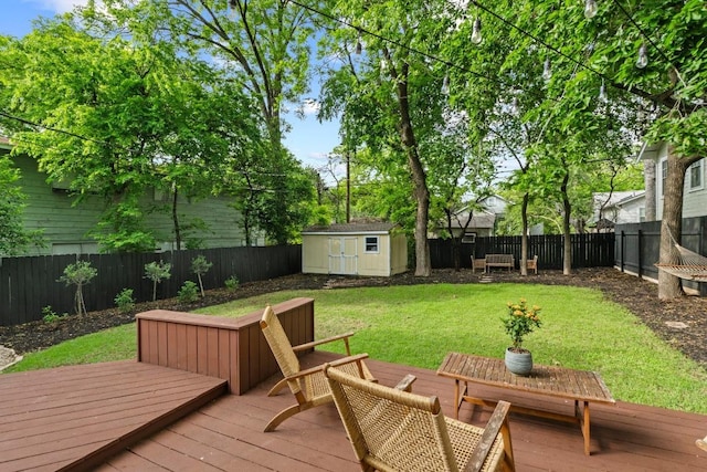 605 E 43rd St, Austin, TX 78751 - wooden terrace featuring a fenced backyard and a shed