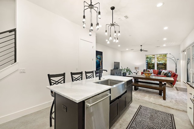 1310 Choquette Dr Unit B, Austin, TX 78757 - kitchen featuring stainless steel dishwasher, concrete floors, open floor plan, recessed lighting, and a kitchen bar