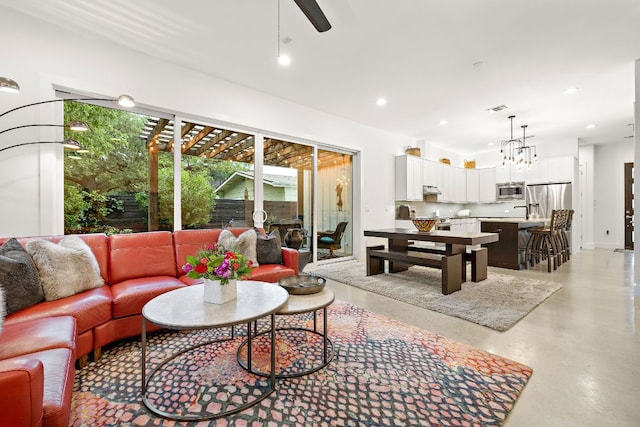 1310 Choquette Dr Unit B, Austin, TX 78757 - living room with recessed lighting, finished concrete floors, and a ceiling fan