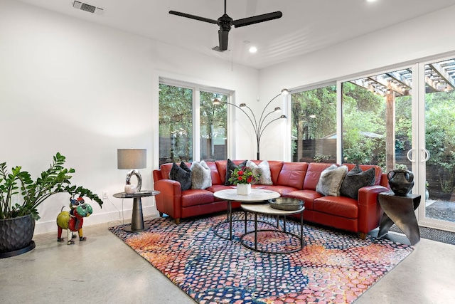 1310 Choquette Dr Unit B, Austin, TX 78757 - living room with ceiling fan, recessed lighting, finished concrete floors, and baseboards