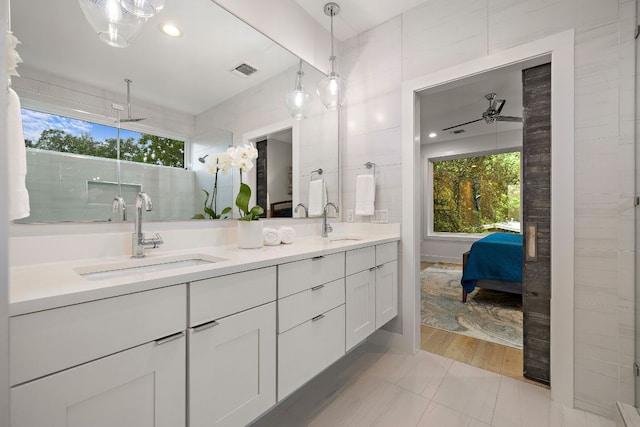 1310 Choquette Dr Unit B, Austin, TX 78757 - ensuite bathroom featuring plenty of natural light, double vanity, and ceiling fan