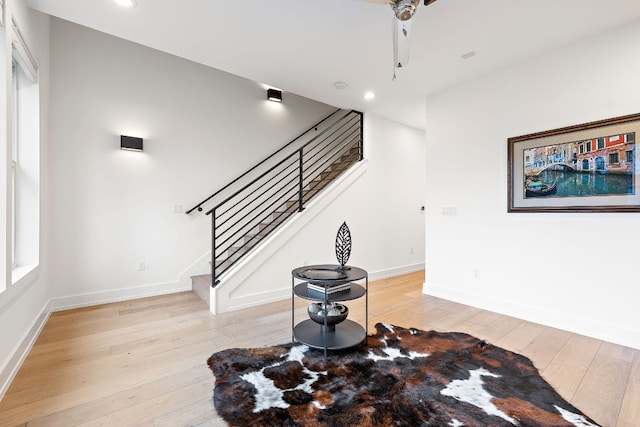 1310 Choquette Dr Unit B, Austin, TX 78757 - unfurnished living room featuring light wood-style floors, recessed lighting, stairs, and baseboards