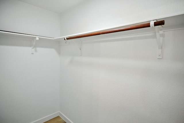 walk in closet featuring light wood-type flooring