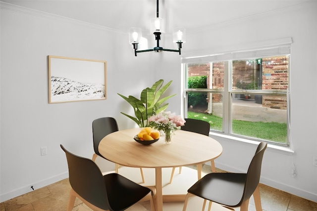 dining area featuring a chandelier, baseboards, ornamental molding, and light tile patterned floors