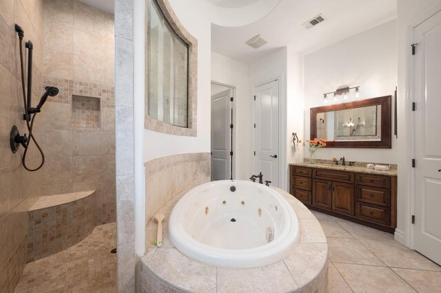 4105 Michael Neill Dr, Austin, TX 78730 - full bath with a jetted tub, walk in shower, vanity, and tile patterned flooring