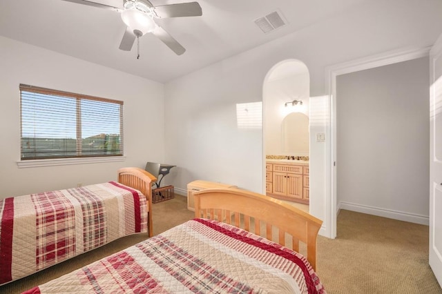 bedroom featuring light colored carpet, baseboards, and ceiling fan