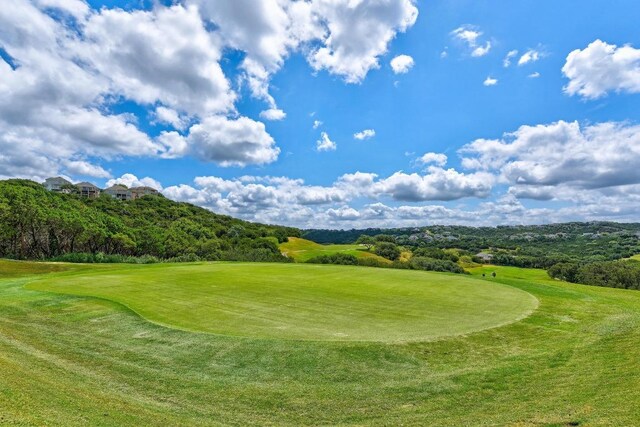 4105 Michael Neill Dr, Austin, TX 78730 - view of community featuring golf course view and a yard