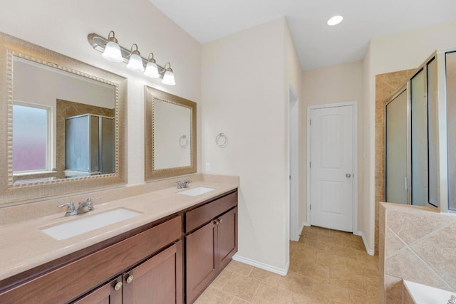 3624 Anchor Bay Dr, Pflugerville, TX 78660 - bathroom with a stall shower, double vanity, baseboards, a tub to relax in, and tile patterned flooring
