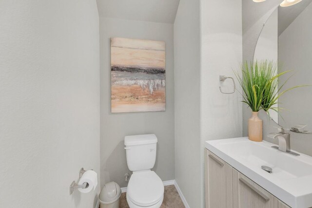 3624 Anchor Bay Dr, Pflugerville, TX 78660 - bathroom with toilet, vanity, and baseboards