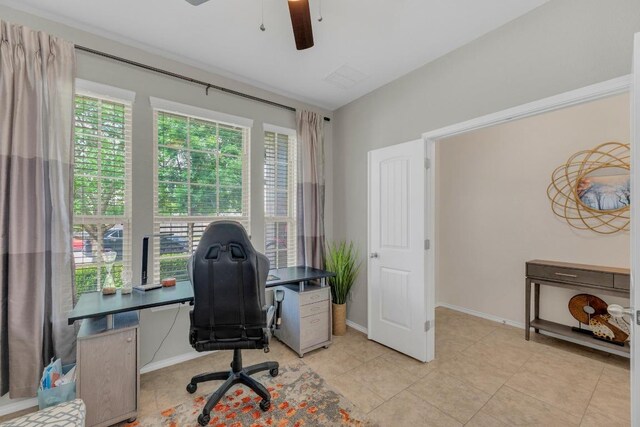 3624 Anchor Bay Dr, Pflugerville, TX 78660 - home office featuring ceiling fan, healthy amount of natural light, light tile patterned floors, and baseboards