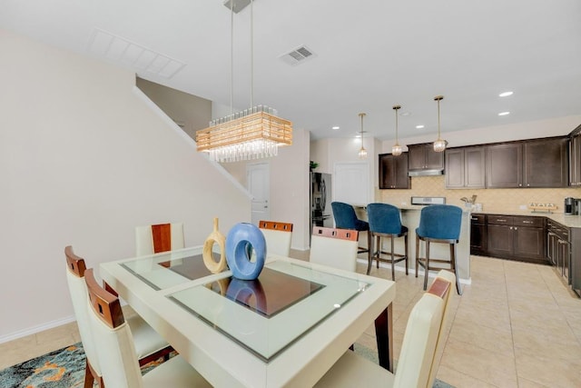 3624 Anchor Bay Dr, Pflugerville, TX 78660 - dining room featuring light tile patterned flooring and recessed lighting