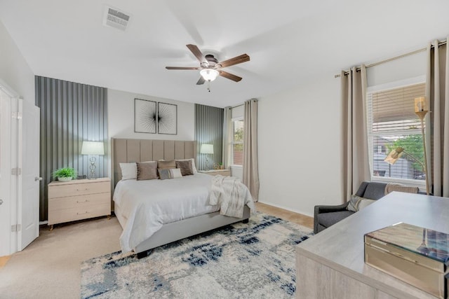 3624 Anchor Bay Dr, Pflugerville, TX 78660 - bedroom with multiple windows, light colored carpet, and a ceiling fan