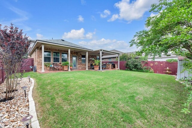 3624 Anchor Bay Dr, Pflugerville, TX 78660 - back of property featuring a patio and brick siding