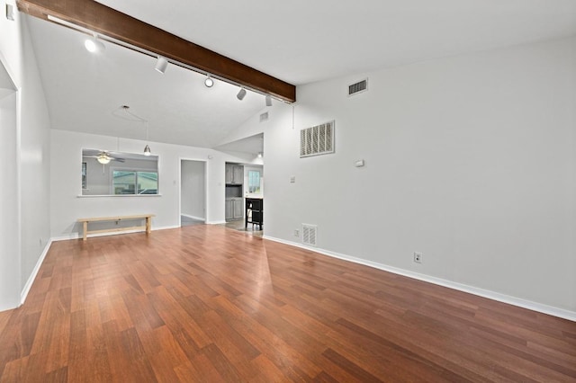 7004 Priscilla Dr, Austin, TX 78752 - unfurnished living room featuring track lighting, wood finished floors, beam ceiling, ceiling fan, and baseboards