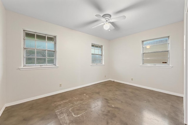 7004 Priscilla Dr, Austin, TX 78752 - empty room featuring concrete flooring, baseboards, and a ceiling fan
