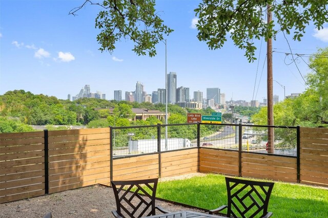 1500 Summit St Unit 5, Austin, TX 78741 - view of patio featuring a view of skyline and fence