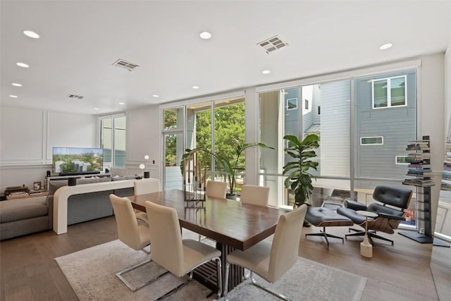 1500 Summit St Unit 5, Austin, TX 78741 - dining area featuring light wood-type flooring, floor to ceiling windows, and recessed lighting