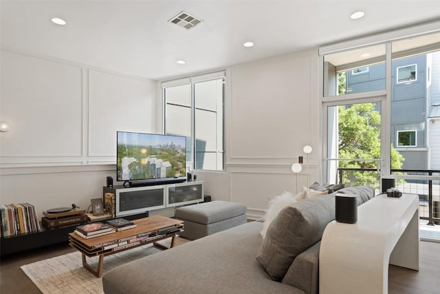 1500 Summit St Unit 5, Austin, TX 78741 - living room with a decorative wall, wood finished floors, and recessed lighting
