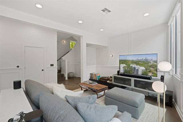 1500 Summit St Unit 5, Austin, TX 78741 - living room featuring a decorative wall, wood finished floors, stairway, recessed lighting, and plenty of natural light