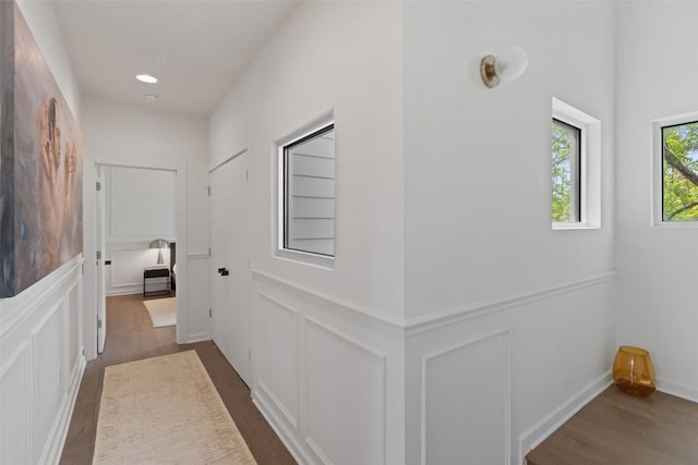 1500 Summit St Unit 5, Austin, TX 78741 - hall featuring dark wood finished floors, a decorative wall, and recessed lighting