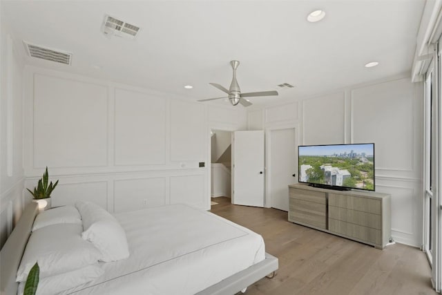 1500 Summit St Unit 5, Austin, TX 78741 - bedroom featuring a decorative wall, light wood-style floors, recessed lighting, and a ceiling fan