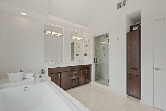 1500 Summit St Unit 5, Austin, TX 78741 - bathroom with a shower stall, a bathtub, double vanity, and lofted ceiling