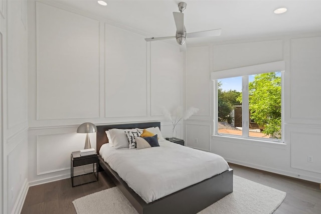 1500 Summit St Unit 5, Austin, TX 78741 - bedroom with a decorative wall, wood finished floors, recessed lighting, and ceiling fan