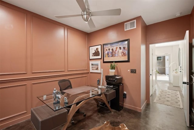 1500 Summit St Unit 5, Austin, TX 78741 - home office featuring ceiling fan, concrete floors, baseboards, and a decorative wall