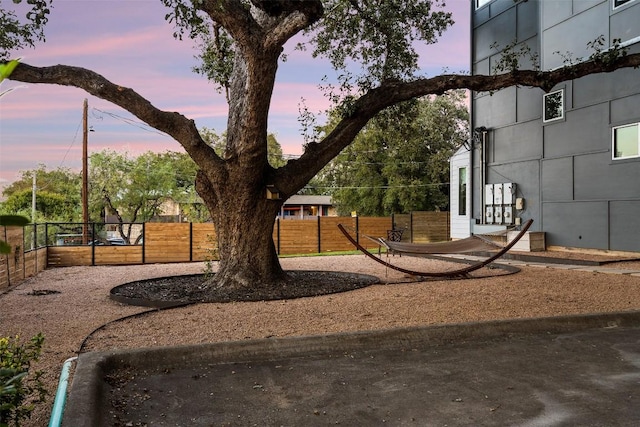1500 Summit St Unit 5, Austin, TX 78741 - yard at dusk featuring fence