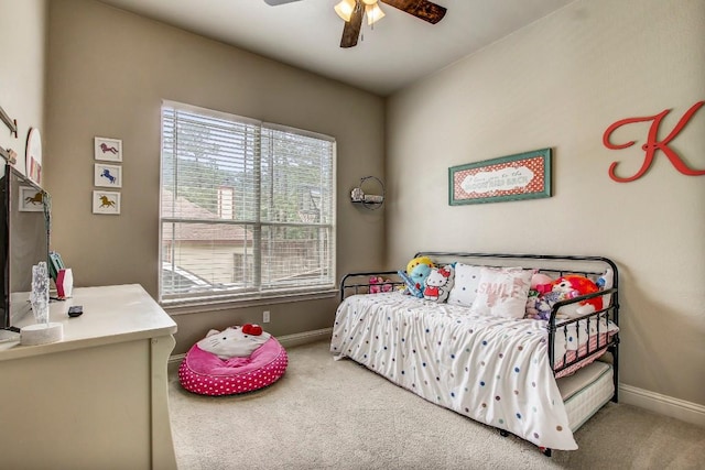 115 Loblolly Ln, Bastrop, TX 78602 - carpeted bedroom with baseboards and a ceiling fan