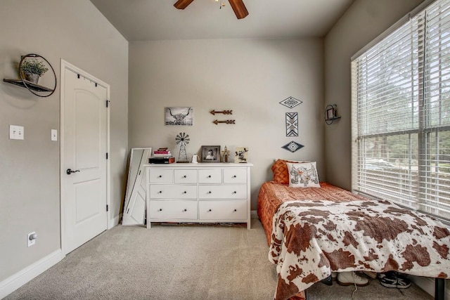 115 Loblolly Ln, Bastrop, TX 78602 - bedroom featuring light colored carpet, baseboards, and ceiling fan