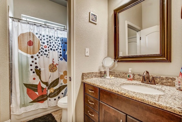 115 Loblolly Ln, Bastrop, TX 78602 - bathroom with a textured wall, toilet, vanity, and a shower with shower curtain