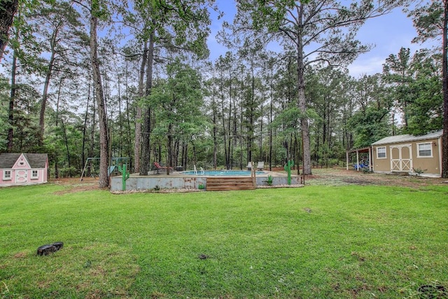 115 Loblolly Ln, Bastrop, TX 78602 - view of grassy yard with a storage unit, an outdoor structure, and an outdoor pool