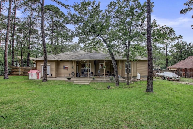 115 Loblolly Ln, Bastrop, TX 78602 - back of property with a patio area