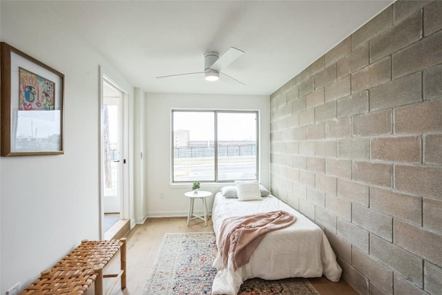 700 Denson Dr Unit 1101, Austin, TX 78752 - bedroom with light wood finished floors and ceiling fan