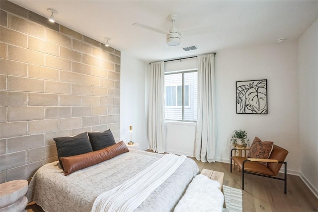700 Denson Dr Unit 1101, Austin, TX 78752 - bedroom with wood finished floors, baseboards, and a ceiling fan