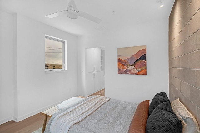 700 Denson Dr Unit 1101, Austin, TX 78752 - bedroom featuring wood finished floors and ceiling fan