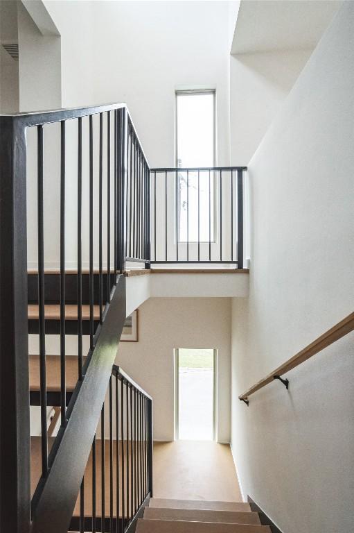 700 Denson Dr Unit 1101, Austin, TX 78752 - stairway with a towering ceiling