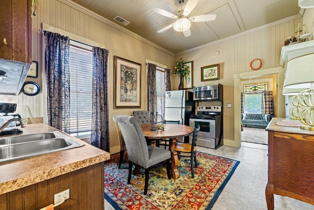 303 Austin St, Fredericksburg, TX 78624 - dining area featuring ornamental molding and a ceiling fan