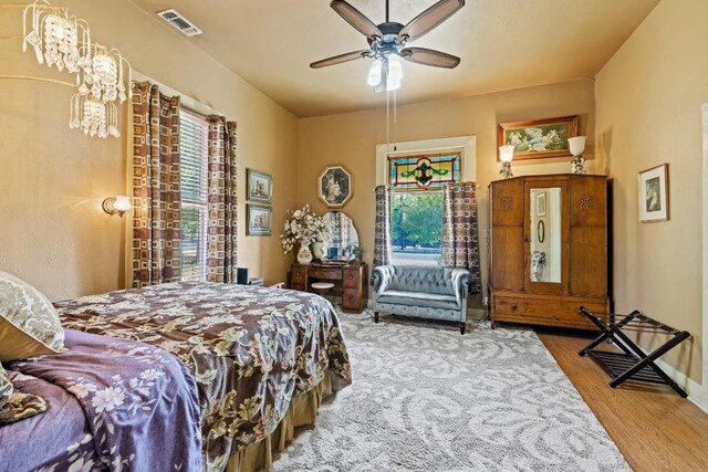 303 Austin St, Fredericksburg, TX 78624 - bedroom featuring wood finished floors, ceiling fan, and baseboards