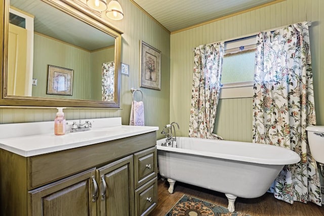303 Austin St, Fredericksburg, TX 78624 - bathroom with a soaking tub, wood finished floors, vanity, and ornamental molding
