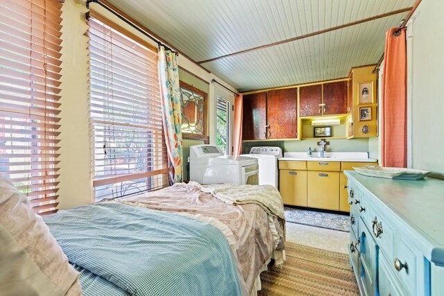 303 Austin St, Fredericksburg, TX 78624 - bedroom with washer and dryer and a sink