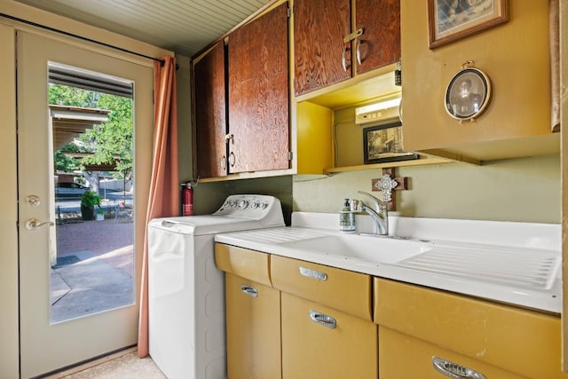 303 Austin St, Fredericksburg, TX 78624 - washroom featuring washer / dryer and cabinet space