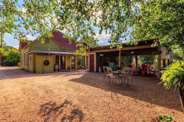 303 Austin St, Fredericksburg, TX 78624 - rear view of property with a standing seam roof and metal roof