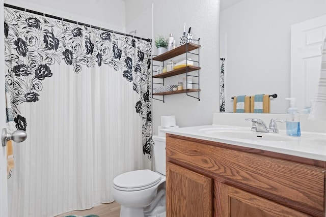 full bath featuring toilet, vanity, wood finished floors, and a shower with curtain
