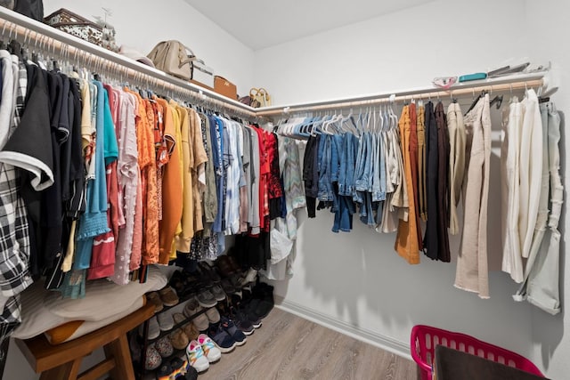 spacious closet with wood finished floors